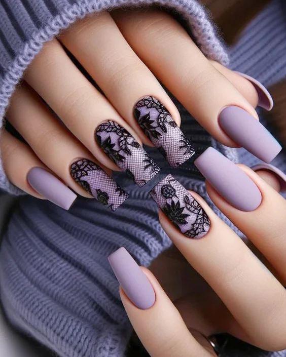 close up of two womans hands with Black Intricate Lace design